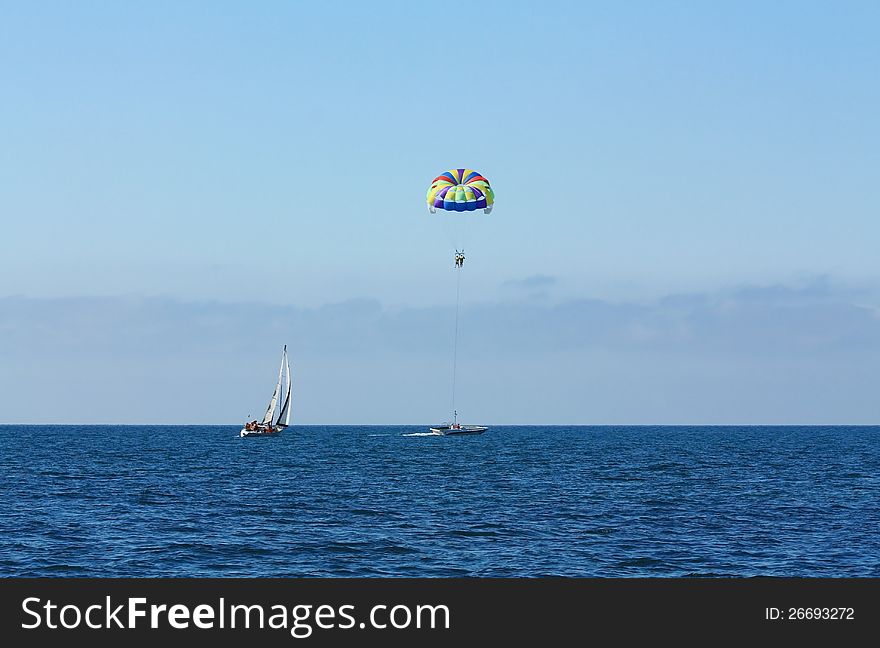 Attraction for tourists on the beach - air travel by parachute. Attraction for tourists on the beach - air travel by parachute