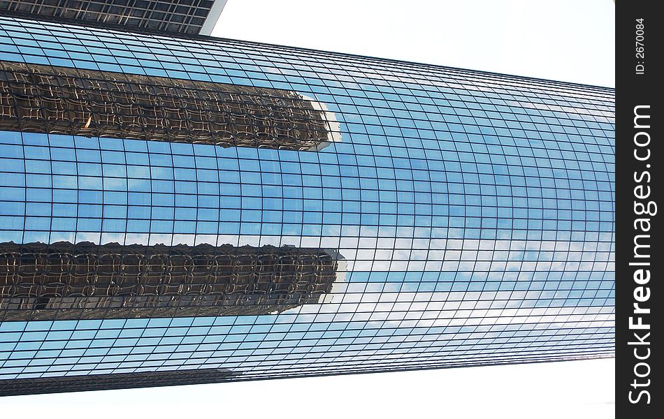 Nice detailed reflection of two buildings over building. Nice detailed reflection of two buildings over building.