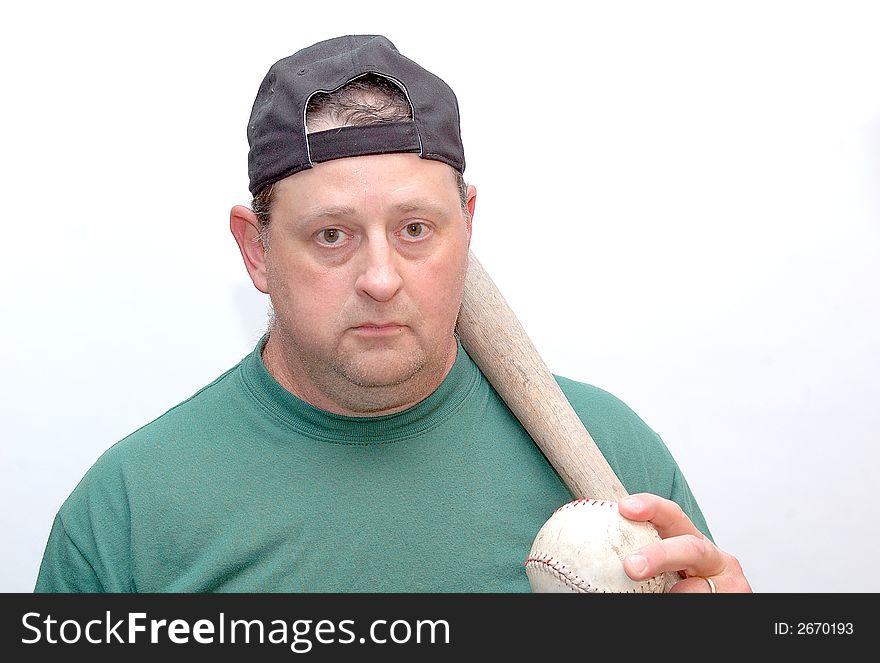 Man holding a bat and softball , ready to play. Man holding a bat and softball , ready to play.