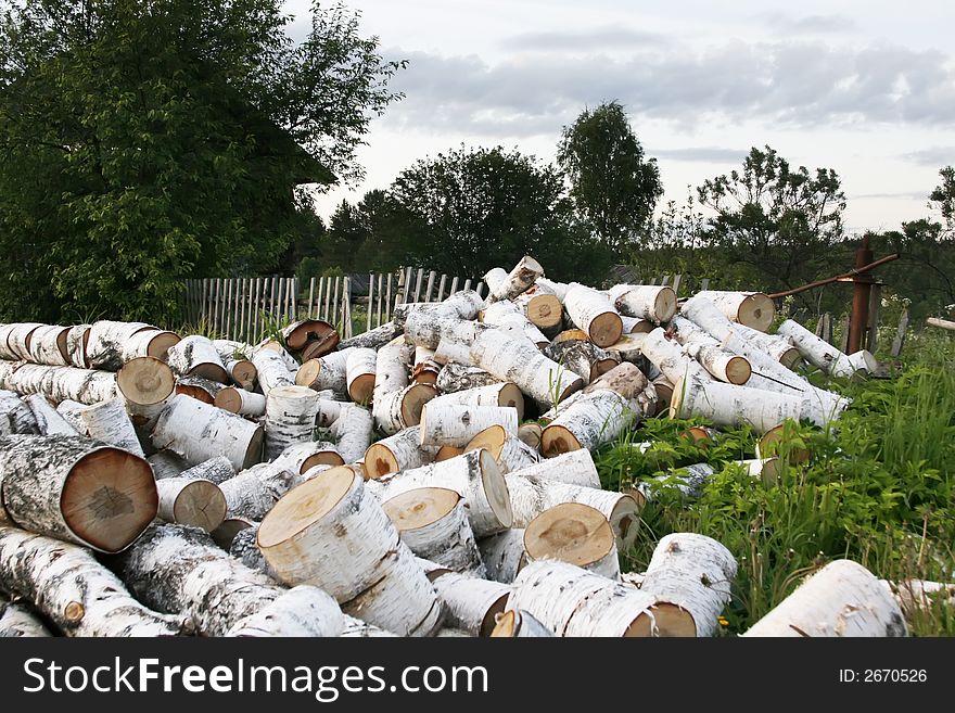 Preparation of fire wood for the winter is one of difficulties of a rural life