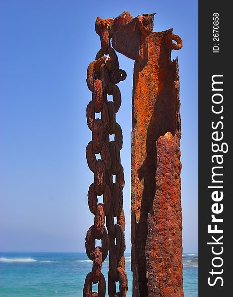 A massive rusty circuit on a rusty metal column in port Caesarea. A massive rusty circuit on a rusty metal column in port Caesarea