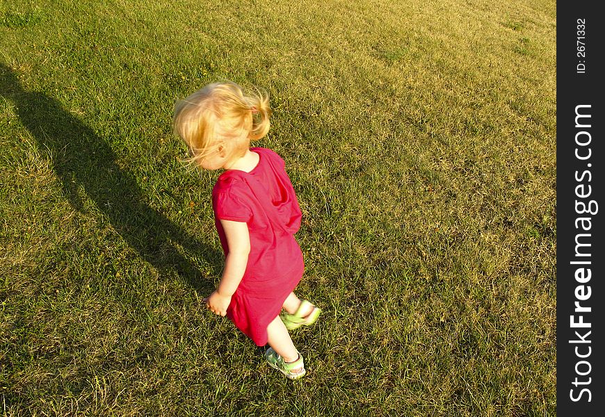 Small child - baby girls - run on the grass. Small child - baby girls - run on the grass
