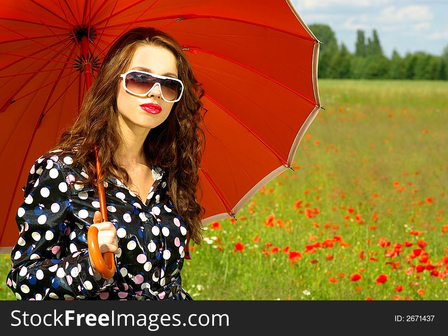 Happy young brunette with orange umbrella. Happy young brunette with orange umbrella