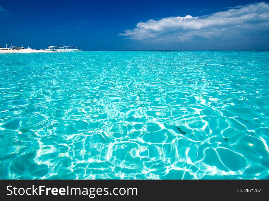 Ocean View of beautiful caribbean blue water beside a secluded white sand beach. Ocean View of beautiful caribbean blue water beside a secluded white sand beach