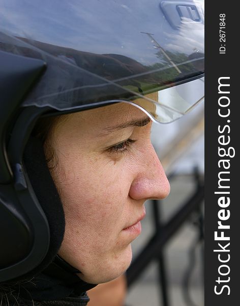 The girl in a helmet for driving on a motorcycle. The girl in a helmet for driving on a motorcycle