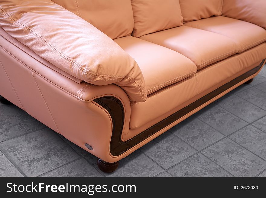 Modern pink sofa on marble to a floor