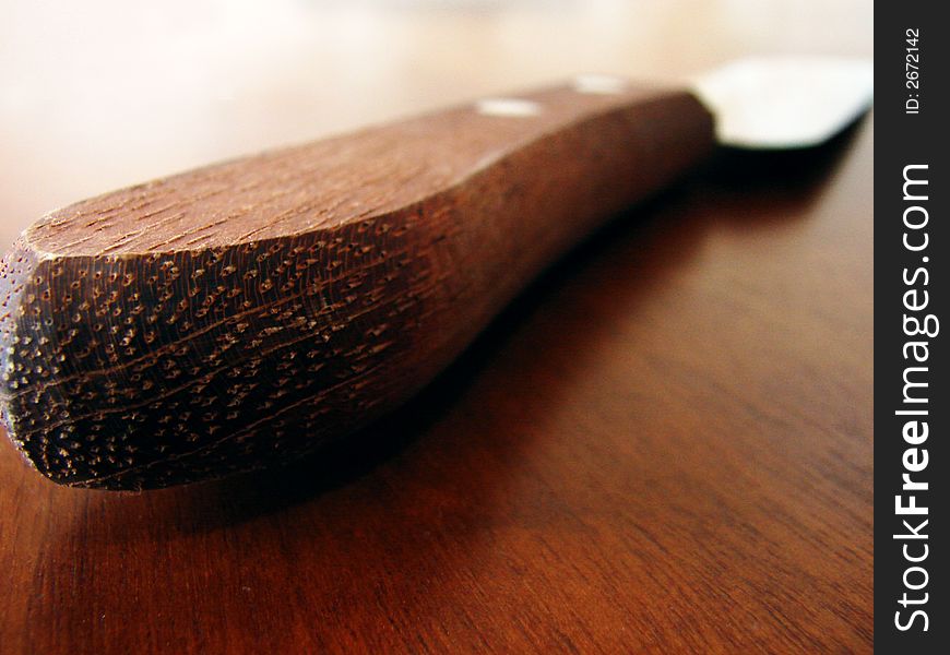 Knife with a wooden handle. Knife with a wooden handle