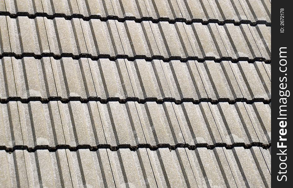 A photo of a roof top tile pattern background. A photo of a roof top tile pattern background.