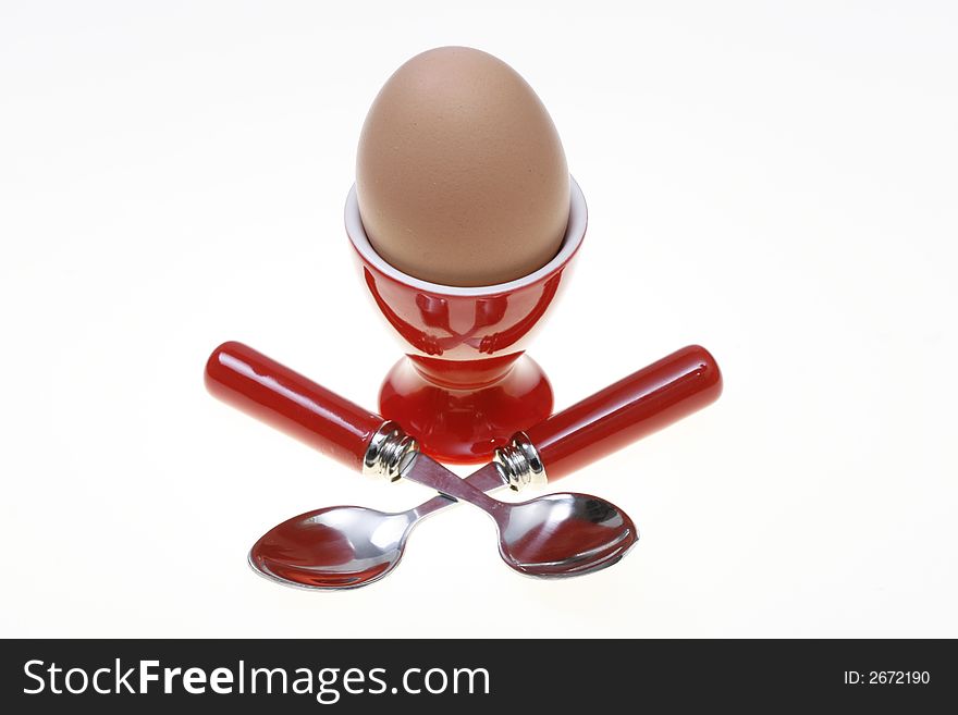Egg in a red egg cup holder. Egg in a red egg cup holder