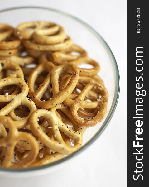 Bowl of salted pretzels in a glass bowl