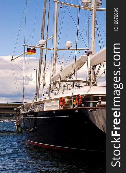 A view of a large, modern, oceangoing sailboat, docked in Newport, Rhode Island. A view of a large, modern, oceangoing sailboat, docked in Newport, Rhode Island.