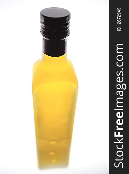 An expensive bottle of olive oil on white background