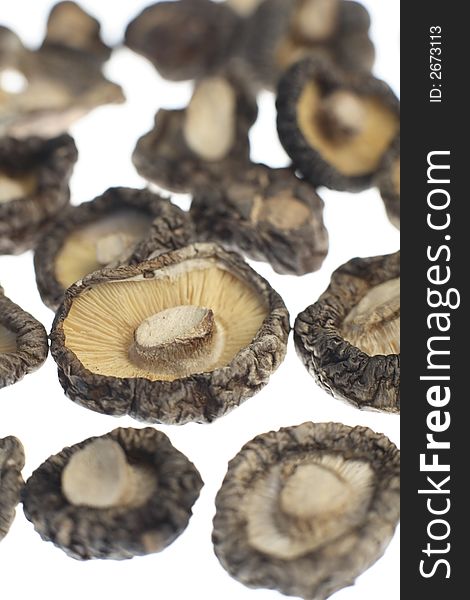 Close up of a ried shiitake mushrooms on white background. Close up of a ried shiitake mushrooms on white background