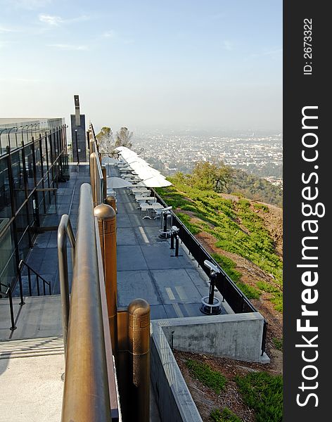 Umbrellas on the terrace of a restaurant overlooking city. Umbrellas on the terrace of a restaurant overlooking city