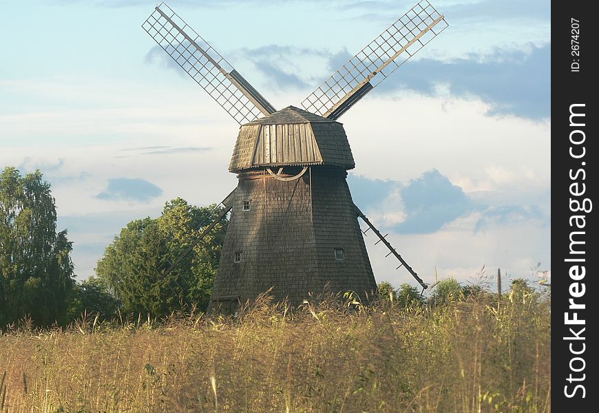 Old mill near new crop