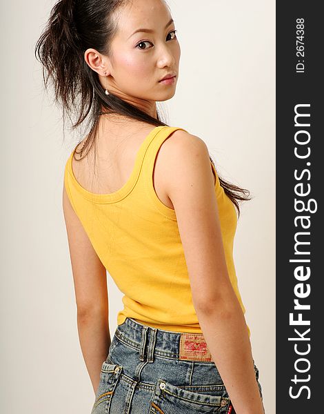 Beautiful Chinese girl in yellow gilet