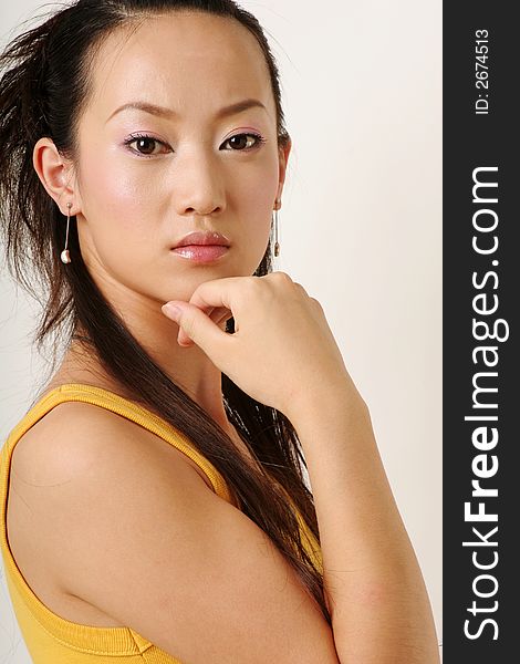 Beautiful Chinese girl in yellow gilet