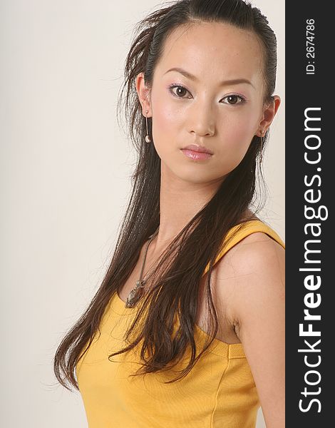 Beautiful Chinese girl in yellow gilet