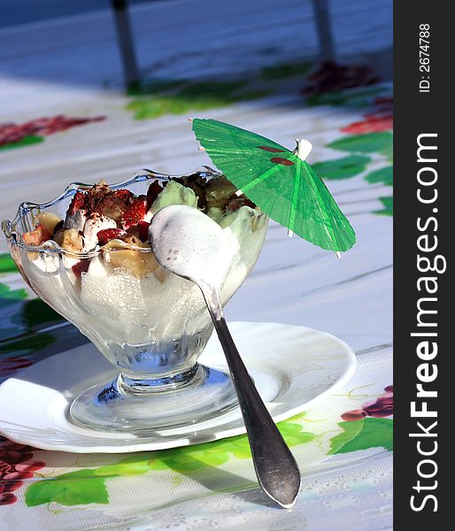 Beautiful ice-cream in glass with fruits and chocolate