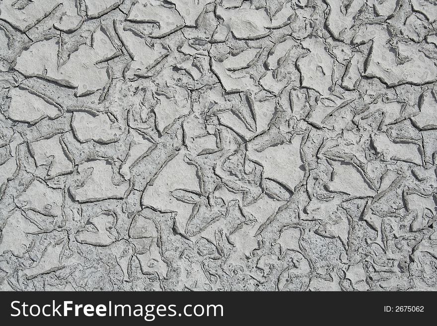 Grey mud texture with cracks. Grey mud texture with cracks