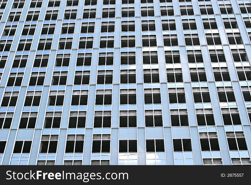 New office tower under construction with empty windows. New office tower under construction with empty windows