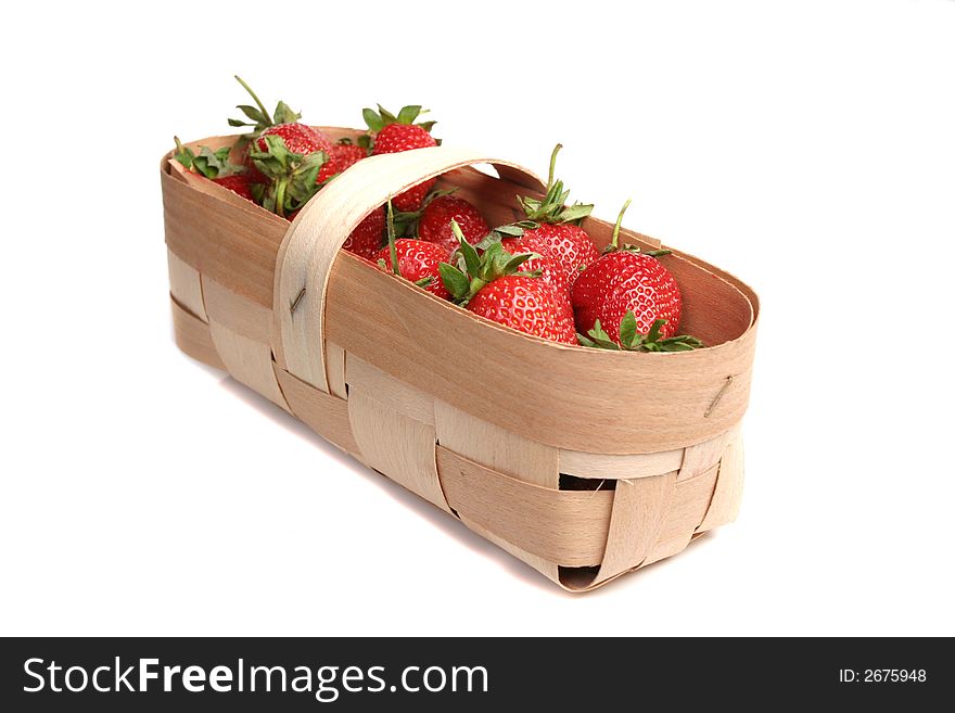 Strawberries in wooden basket isolated over white background. Strawberries in wooden basket isolated over white background