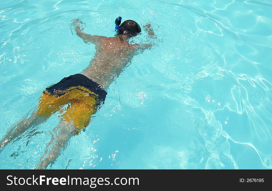 Swimming teen in the pool