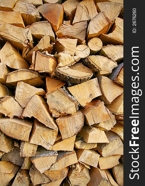Detail of arranged pile of chopped fire wood logs. Detail of arranged pile of chopped fire wood logs