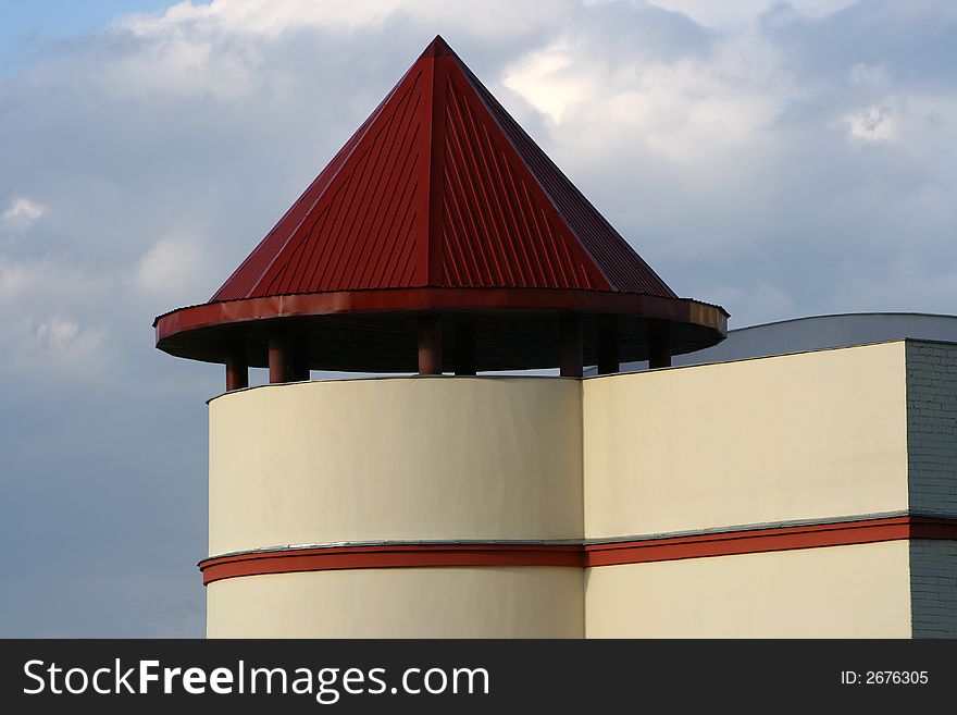 Part of a building with the conic roof costing on columns. Part of a building with the conic roof costing on columns.