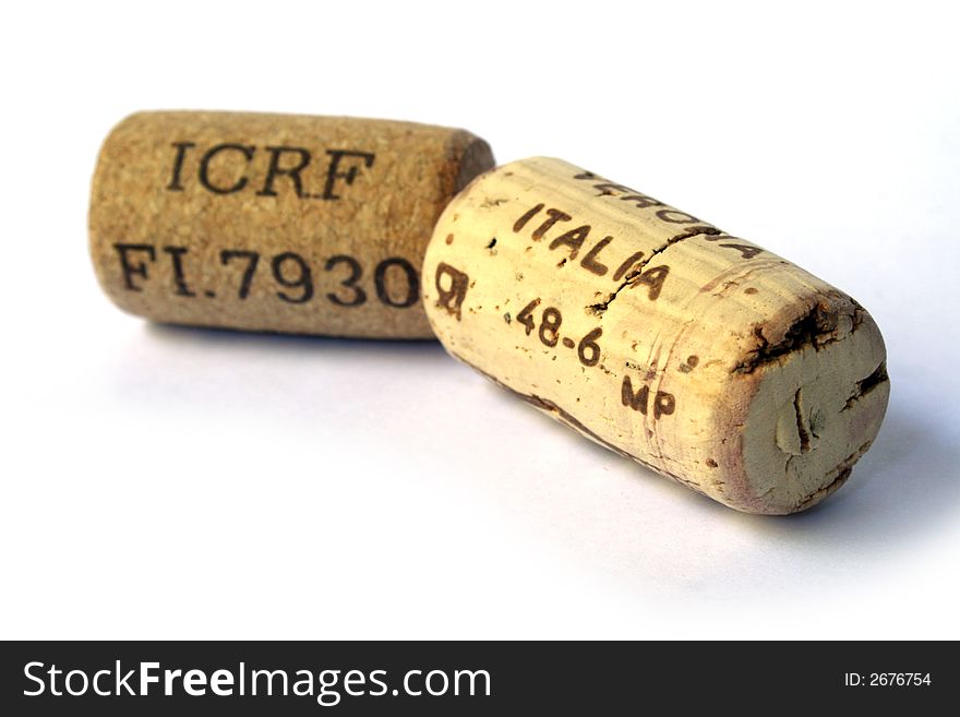 Two corks of good wine on white background. Two corks of good wine on white background