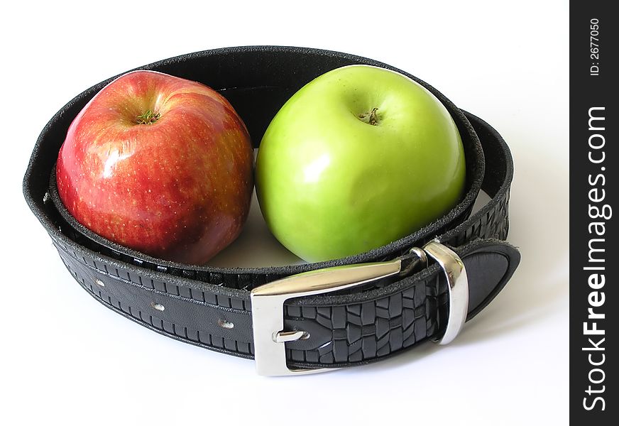 Two apples, red and green in a belt. Two apples, red and green in a belt