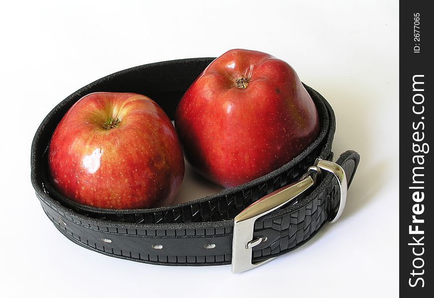 Two red apples in a belt. isolated. Two red apples in a belt. isolated