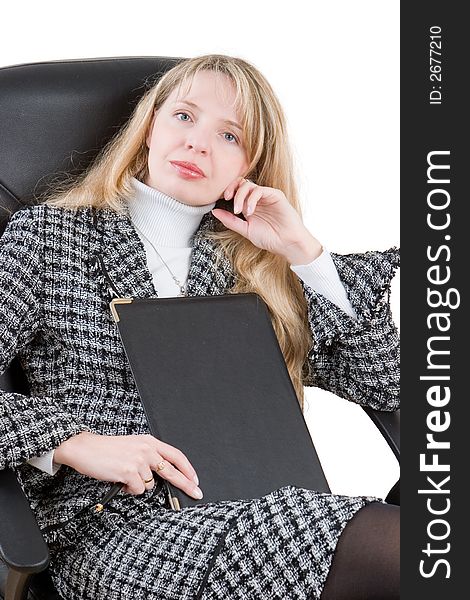 A business woman sitting in a black chair