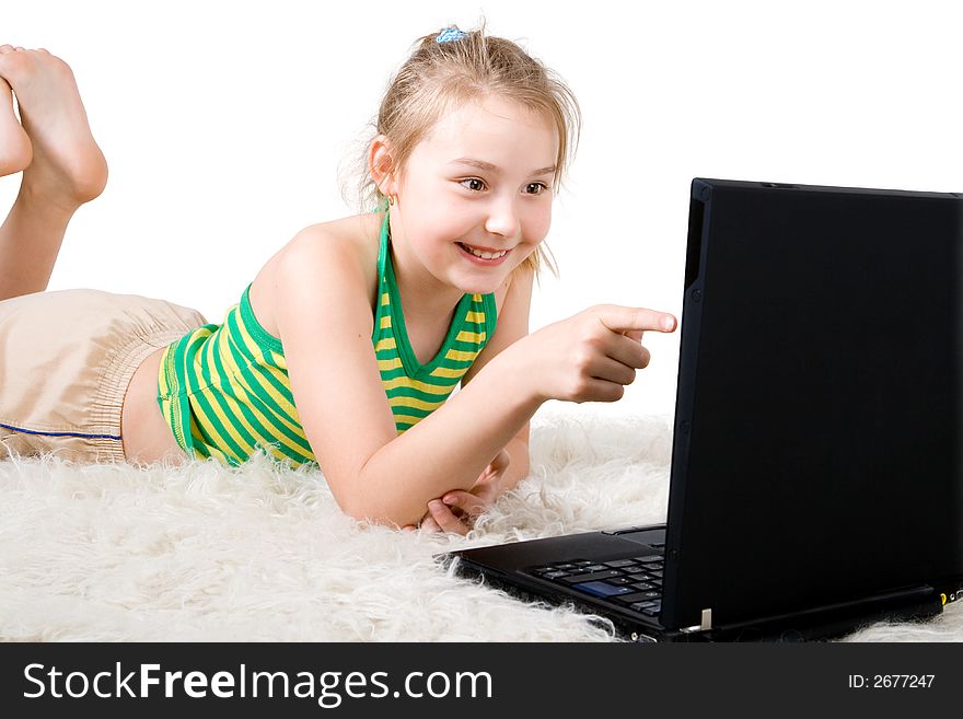 An attractive girl pointing at a laptop screen
