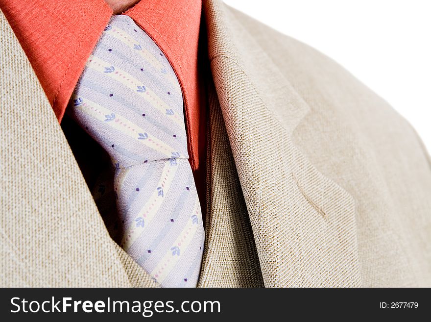 A close up of a suit and tie with a white background