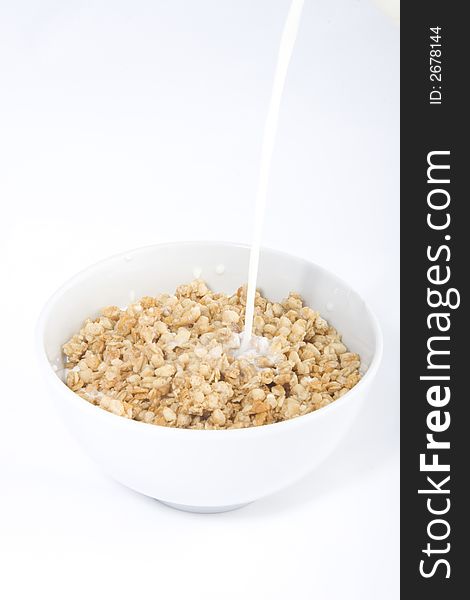 Photo of the cereals with the milk running on them