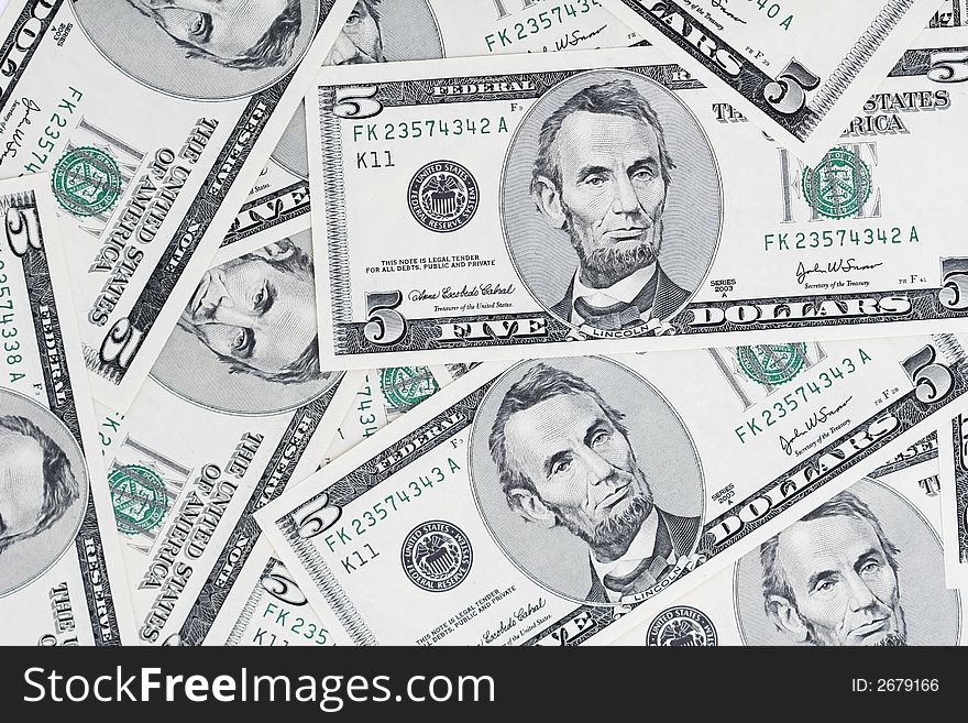 A close up of a bunch of 5 dollar bills, great background,. A close up of a bunch of 5 dollar bills, great background,