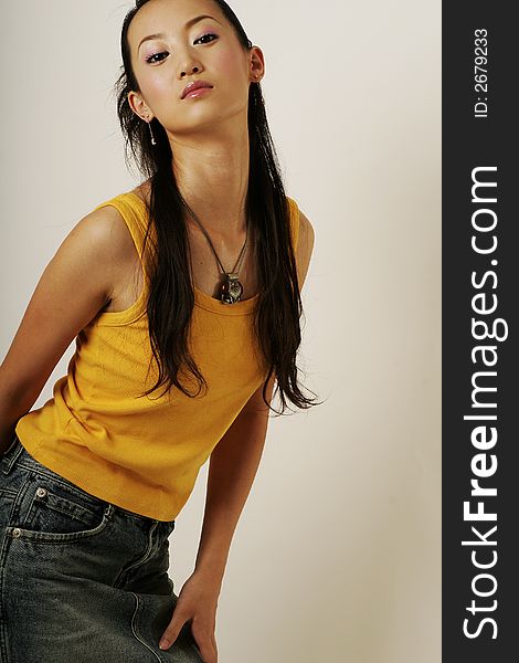 Beautiful Chinese girl in yellow gilet