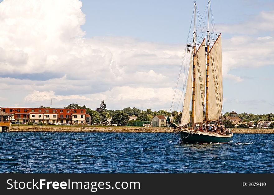 A view of a two masted sailboat or schooner approaching. A view of a two masted sailboat or schooner approaching.