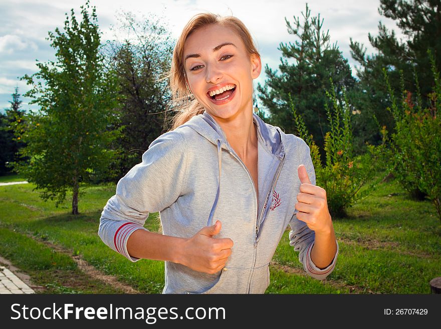 Pretty young woman runner in the forest. Pretty young woman runner in the forest.