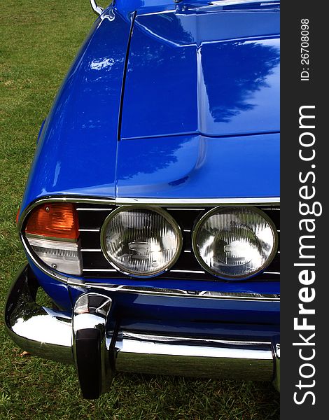 A close-up image of a blue vintage car