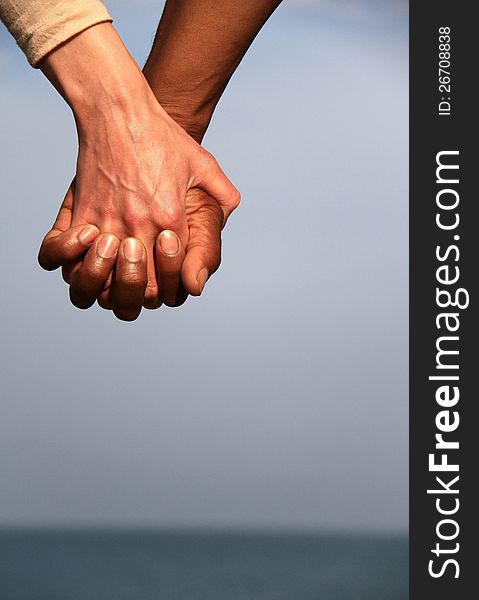 Image of a couple holding hands
