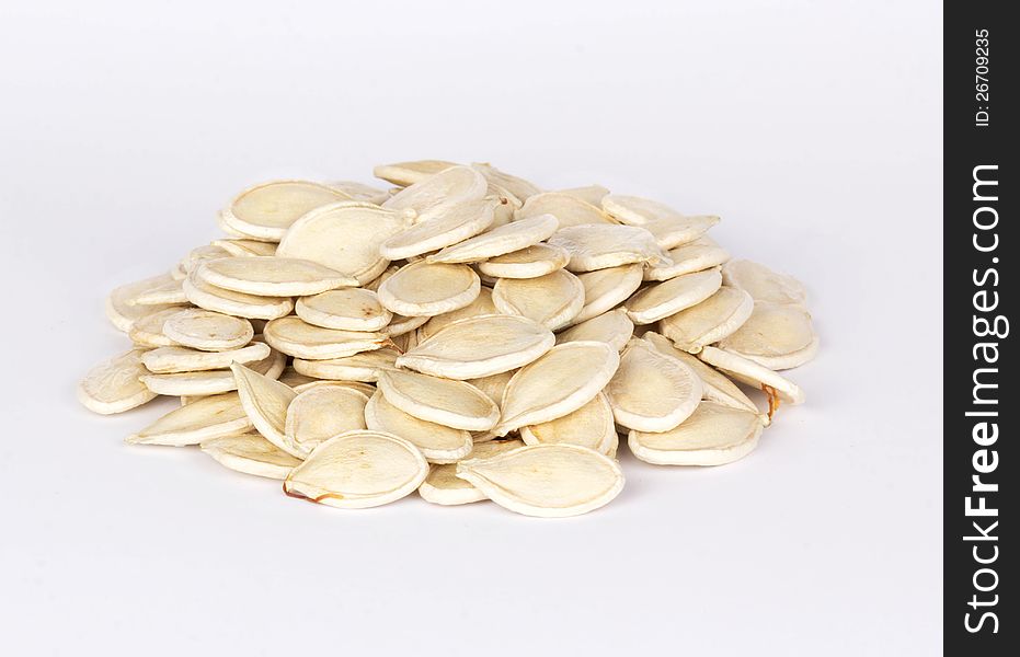 Pile of pumpkin seeds isolated on white background