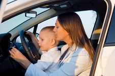 Mother Teaching Small Son To Drive Royalty Free Stock Images