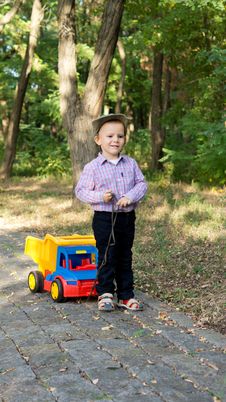 Boy Pulling A Toy Truck On A Paved Lane Stock Image Boy Pulling A Toy Truck On A Paved Lane Stock Image
