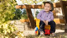 Young Boy Sitting In A Toy Dump Truck Stock Photos Young Boy Sitting In A Toy Dump Truck Stock Photos