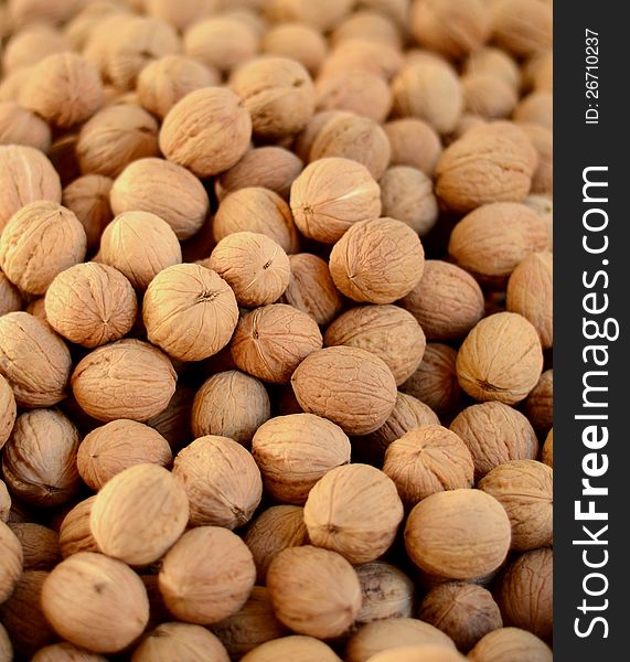 A Heap Of Walnuts At A Market With Shallow Depth Of Focus. A Heap Of Walnuts At A Market With Shallow Depth Of Focus