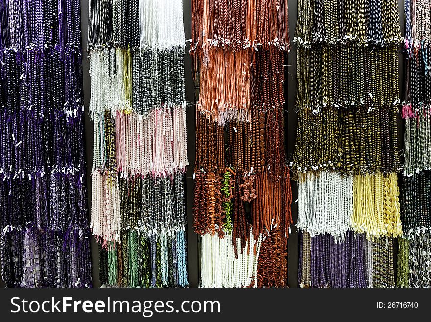 Colorful necklaces on a wall