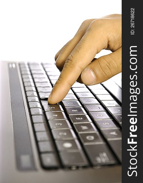 Man touching laptop button. Shot with shallow DOF. Man touching laptop button. Shot with shallow DOF