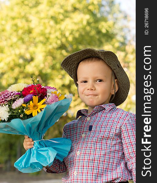 Happy youngster with bouquet of flowers